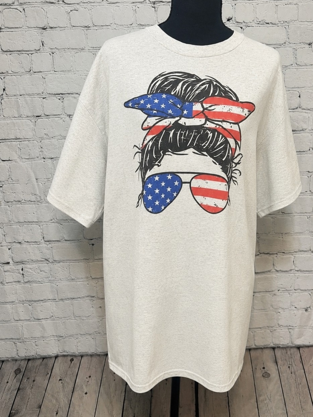 Women’s boutique Cream Graphic Tee with American Flag Sunglasses